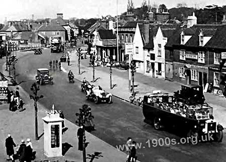 1920s or 1930s street scene showing the early public call box