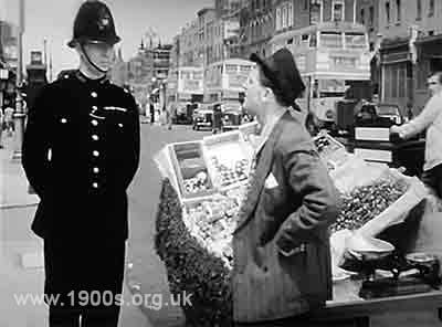 Barrow boy being accosted by a policeman