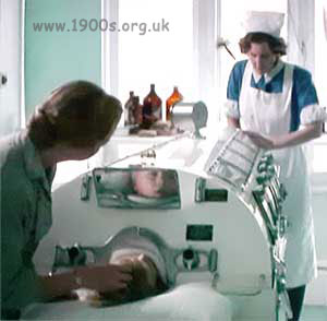 View along an iron lung from showing the patient's head