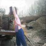 coalman loading sacks of coal onto a lorry, courtesy of Terry Martinelli.