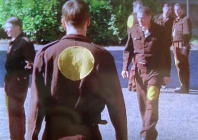 Uniform of foreign prisoners of war held 
    in UK in WW2 showing characteristic yellow circle uniform