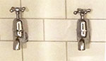 Taps of a wash basin in a 1940s English suburban house