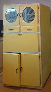 yellow 1950s kitchen cabinet with closed integral pastry-board