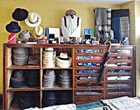 Typical dark wood and glass display units as seen inside drapers shops in the early to mid 1900s