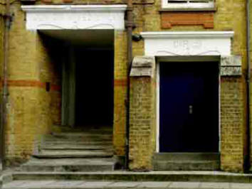 Typical early 1900s school entrances - for infants on the left and girls on the right, leading from a shared playground to separate floors, the ground floor for infants and first floor for girls