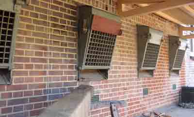 Window grids which could be lowered to act as sieves or measures for 
the rocks broken-up by vagrants in a casual ward (also known as a dosshouse).